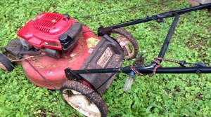 Lawnmower held together with vice grips and bungy cords